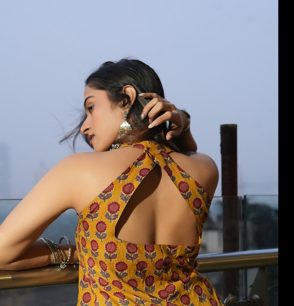 Woman in a Marigold Kurti dress with a blurred background