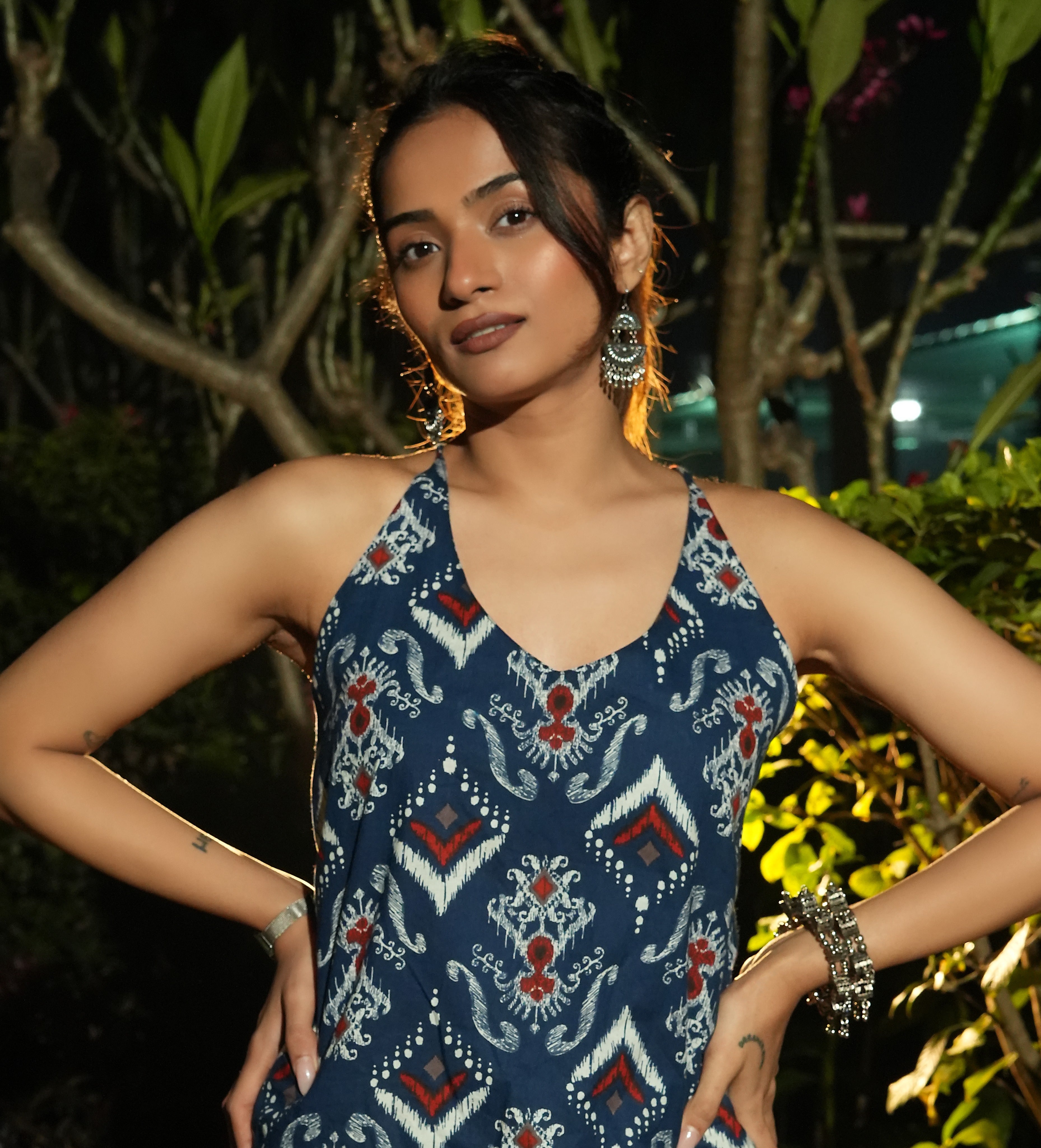 Woman wearing a Neel ikat kurta with jewelry in an outdoor setting